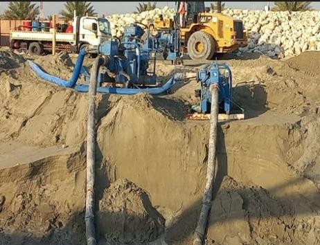 SAZEC GROUP construction earthworks with dump truck and worker in PPE