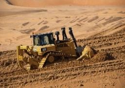 SAZEC GROUP Caterpillar bulldozer on desert earthworks