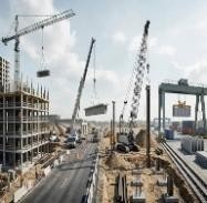 SAZEC GROUP multi-crane construction site with mobile and tower cranes