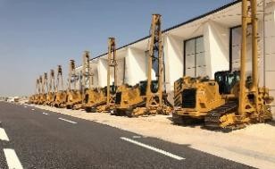 SAZEC GROUP row of yellow piling and shoring rigs