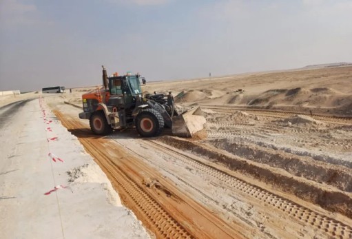 SAZEC GROUP wheel loader grading sandy construction access road