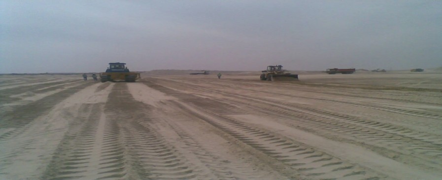 SAZEC GROUP bulldozers and compactors on desert earthworks